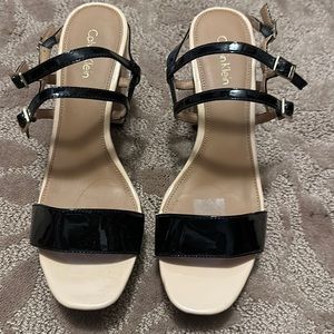 Calvin Klein heeled sandle. Size 9. Tan and black with gold buckles.
